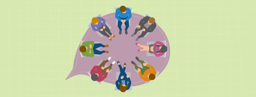 people sitting in a circle at a support group meeting
