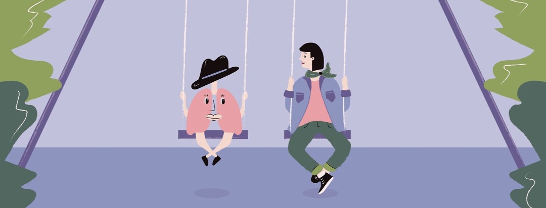 A woman on a swing next to a pair of lungs