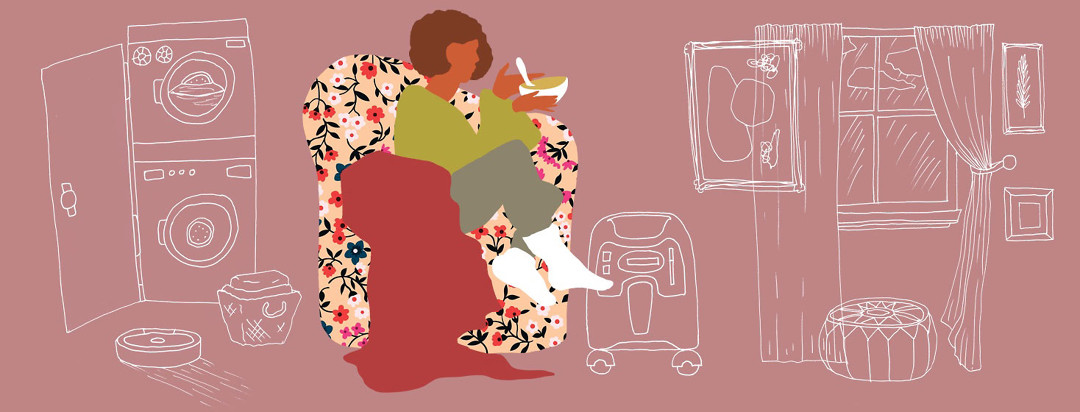 a woman is cozy and snuggling in a chair with soup and blanket as she does laundry and her zoomba cleans the house