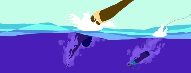 a man dives into the ocean water and right behind him his oxygen tanks dives in as well