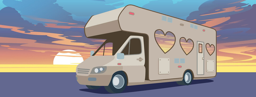 an RV camper with heart-shaped windows, is parked in front of a sunset.