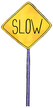 A street sign with the word SLOW on it